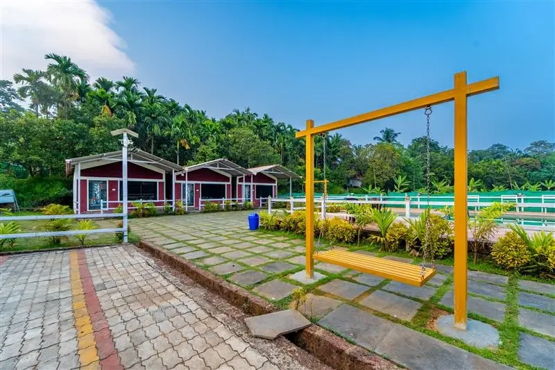 Prithvi Jungle Stay cottages and garden swing, Dandeli