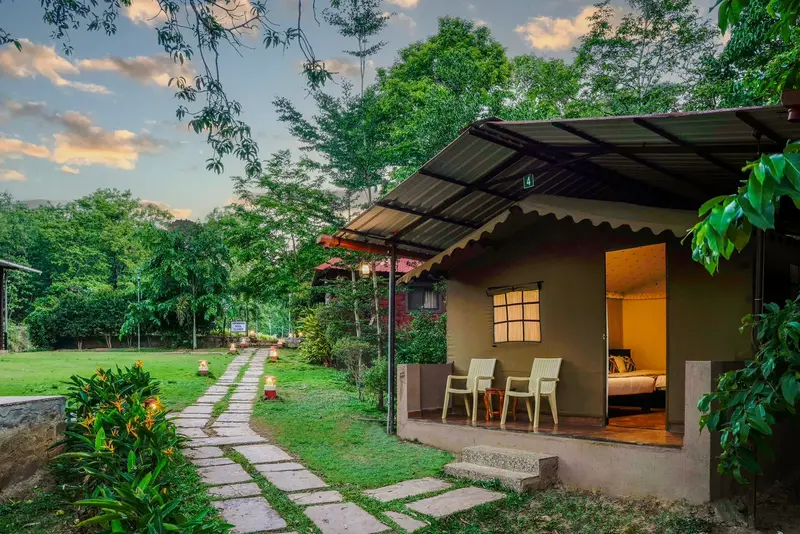 Pool and cottages at a Dandeli resort